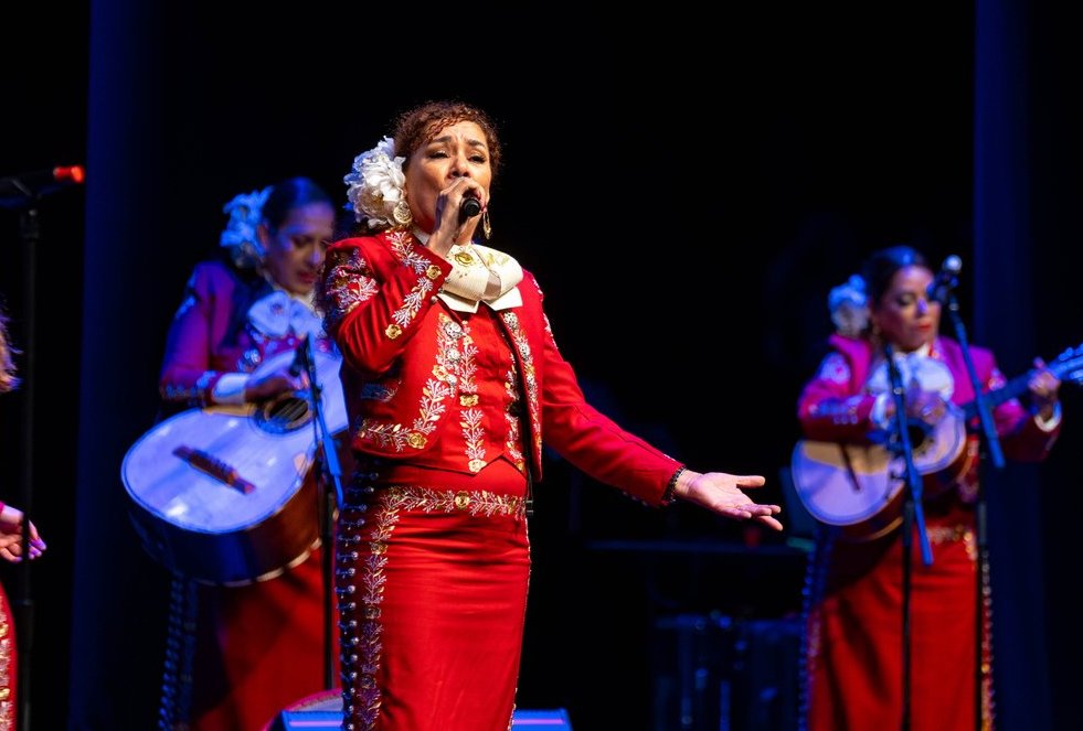 Mariachi Bonitas de Dinorah member singing.