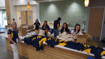People arranging swag for conference