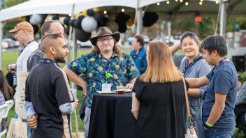 Attendees talking around a table