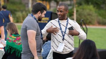 Two attendees having a conversation.