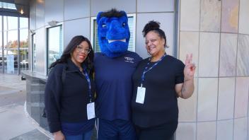 Attendees posing with Gunrock.