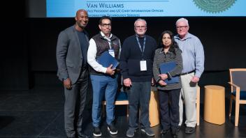UC Tech Award recipients posing for a photo with CIOs Van Williams and Viji Murali.