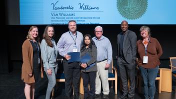 UC Tech Award recipients posing for a photo with CIOs Van Williams and Viji Murali.
