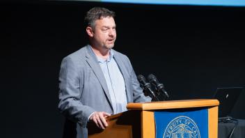 UC Tech Award recipient speaking at the podium.