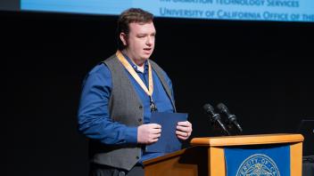 UC Tech Award recipient speaking at the podium.