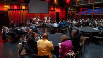 Attendees sitting in for a performance by the Crackerjack Polka Band during the Monday evening reception at UC Tech