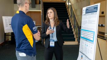 UC Tech poster presenter speaking on their poster presentation