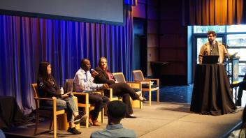 UC Tech panel speaking on stage