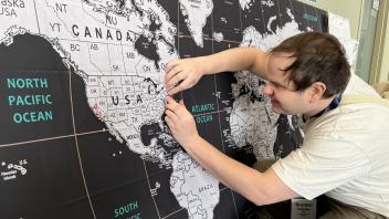 Attendee pins his hometown on the UC Tech map.