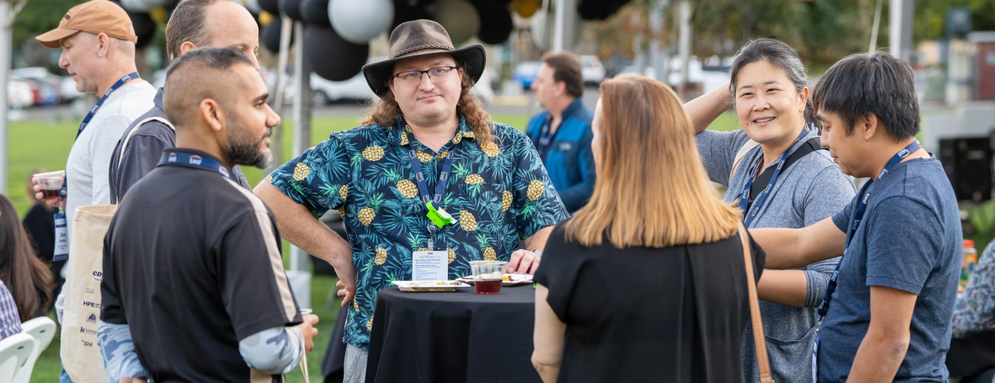 Attendees talking around a table