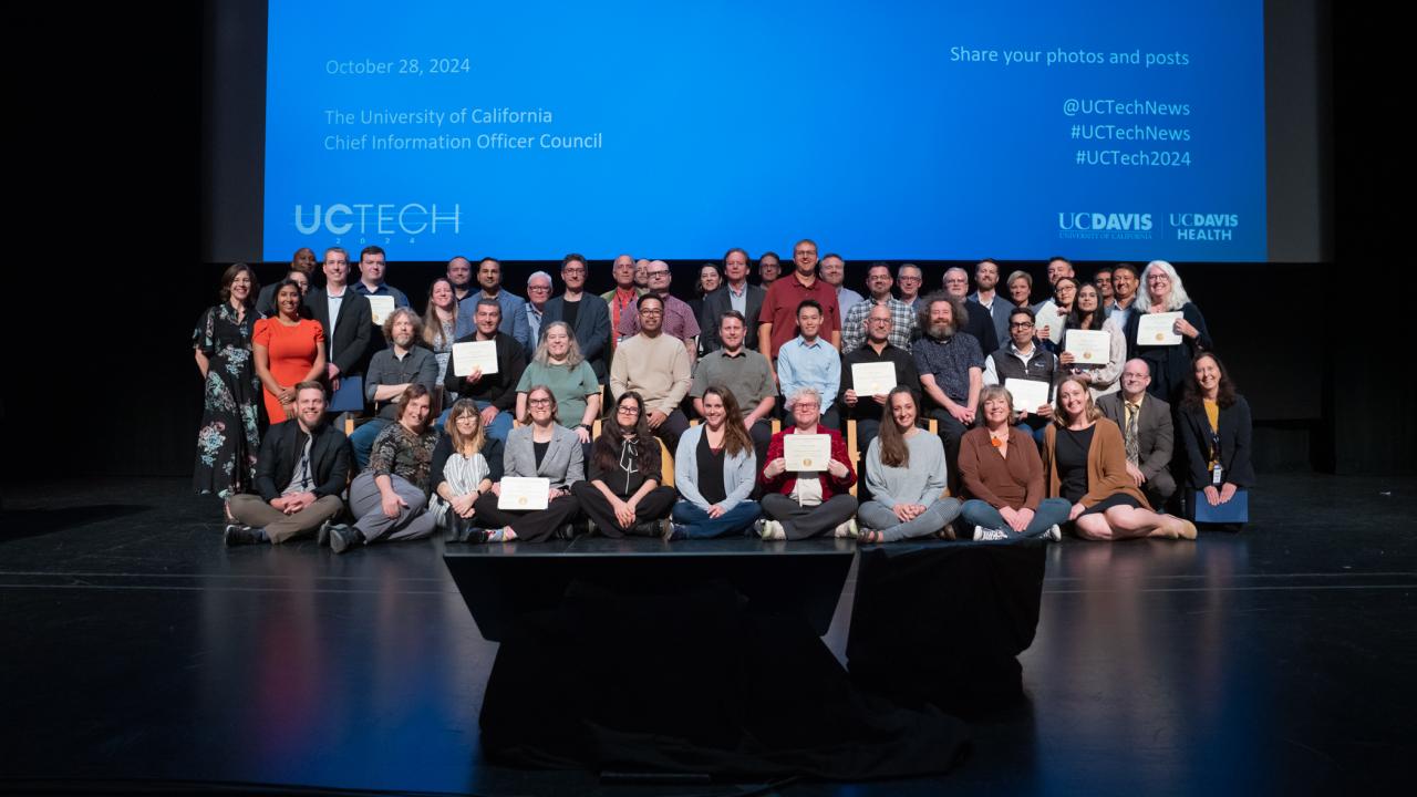 UC Tech Award recipients posing for a photo with CIOs Van Williams and Viji Murali.